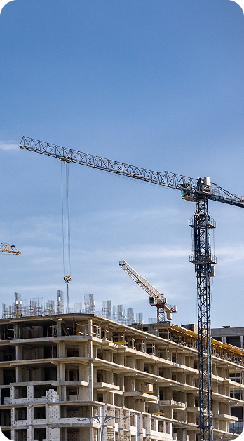 Construction crane over a building site reflecting workforce solutions by Fluid Resourcing in housing and the built environment