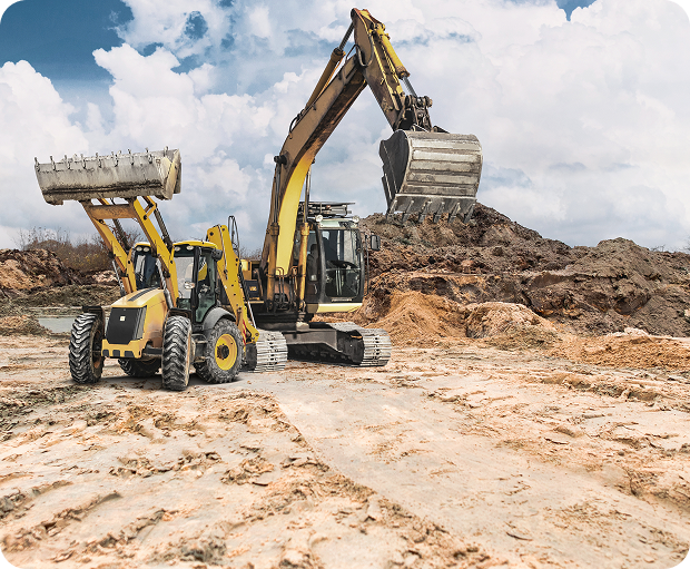 Two construction machines operating on a dirt site, reflecting In Person Relocations staffing solutions from Fluid Resourcing