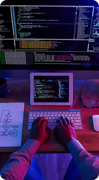 Person typing on a keyboard with a screen showing digital and AI tools, supporting workforce solutions by Fluid Resourcing
